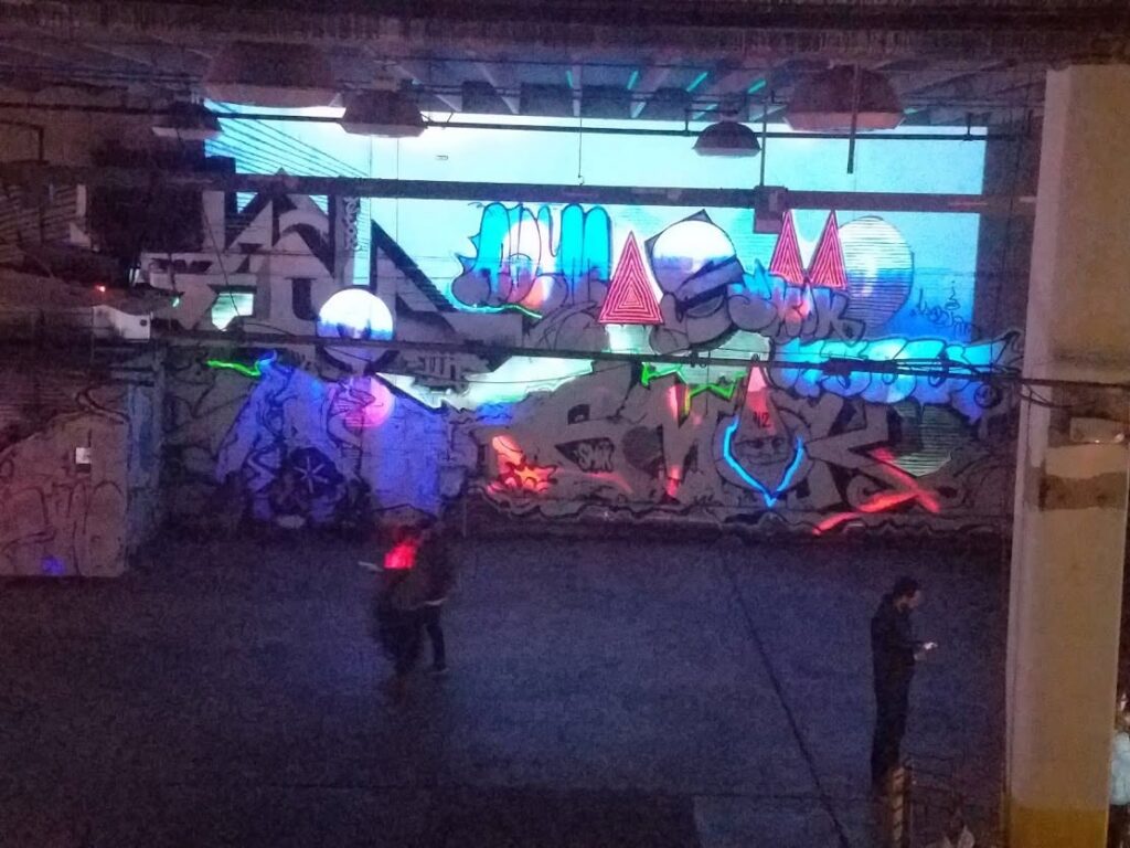 The graffiti wall with blue and pink projection mapping at Nashville Night Market